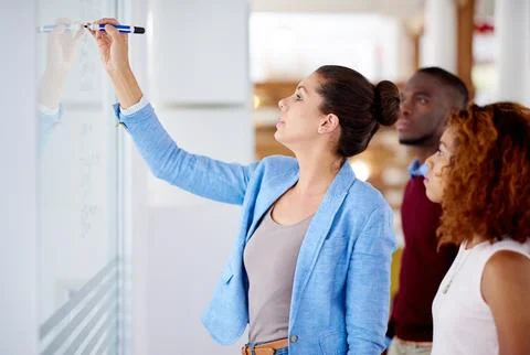 Problem solving, business people and writing on glass board in meeting for Stock Photos