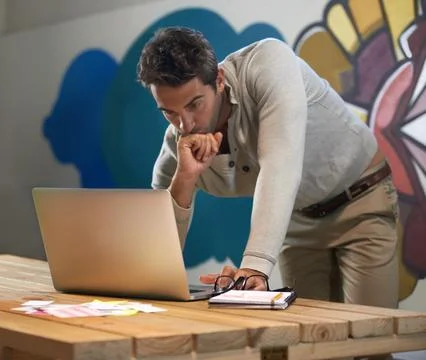 Problem solving, creative and man at laptop thinking for solution, online Stock Photos