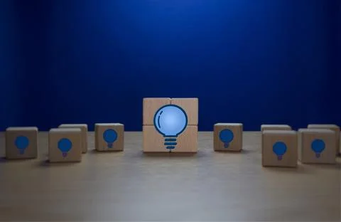 Problem Solving, New Wisdom, Bright Light Bulb Surrounded by Dark Light Bulbs Stock Photos