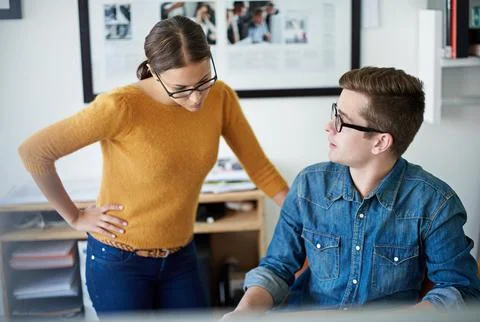 Problem-solving professionals at work. Shot of two colleagues working together Stock Photos