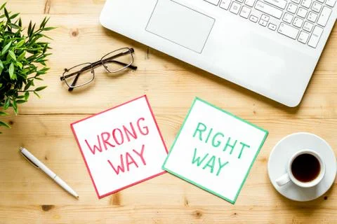 Problem solving. Right and wrong way icons on work desk from above 스톡 사진