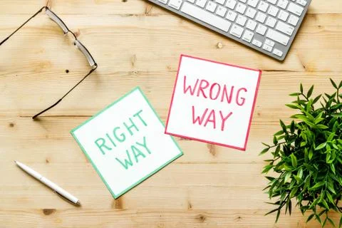 Problem solving. Right and wrong way icons on work desk from above 스톡 사진
