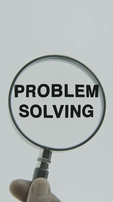 Problem Solving text or word highlighted by a magnifying glass in a hand Stock Footage 303504219