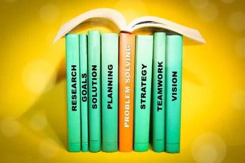 Problem Solving theme - books with relevant words on spine. Stock Photos
