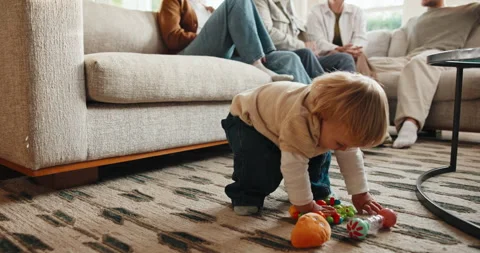 Problem solving, toy and walking with baby boy in home living room for motor Stock Footage 341426142