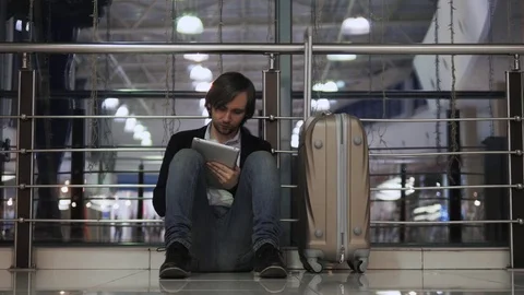 Problem with transportation, delay of flight, depressed man with his luggage and Stock Footage 69839824