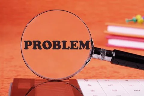 PROBLEM word written through a magnifying glass on an orange background Foto stock