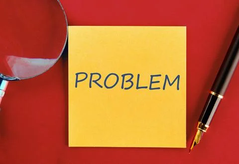 PROBLEM written on a yellow sticker on a red background Stock Photos