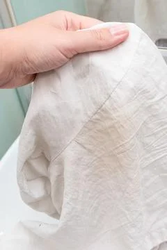 Problem of yellow sweat and deodorant stain on white clothes shirt under ar.. Stock Photos