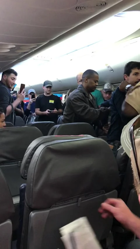 Problematic Man Tased and Removed from Airplane, Miami, Florida, USA - 22 Apr 20 Stock Footage 205255154