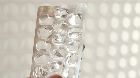 Problematic treatment.Empty pill box.Empty packaging of pills in a female hand Stock Footage 231913188