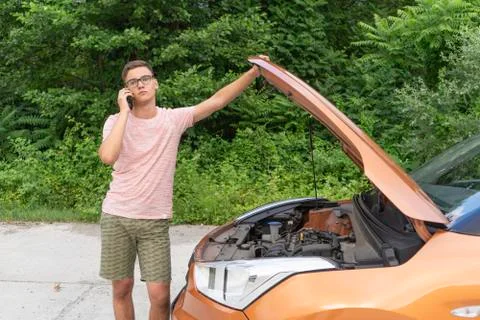 Problems with the car at the beginner driver on the road. Driver asks for hel Stock Photos