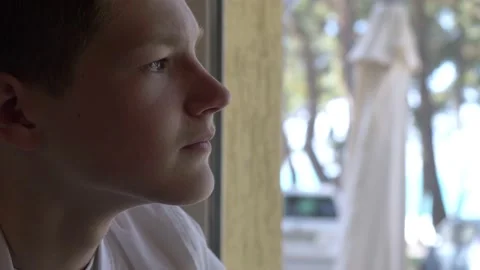 Problems, concern - guy sitting at the bar alone looks out thoughtfully Video stock 201263731