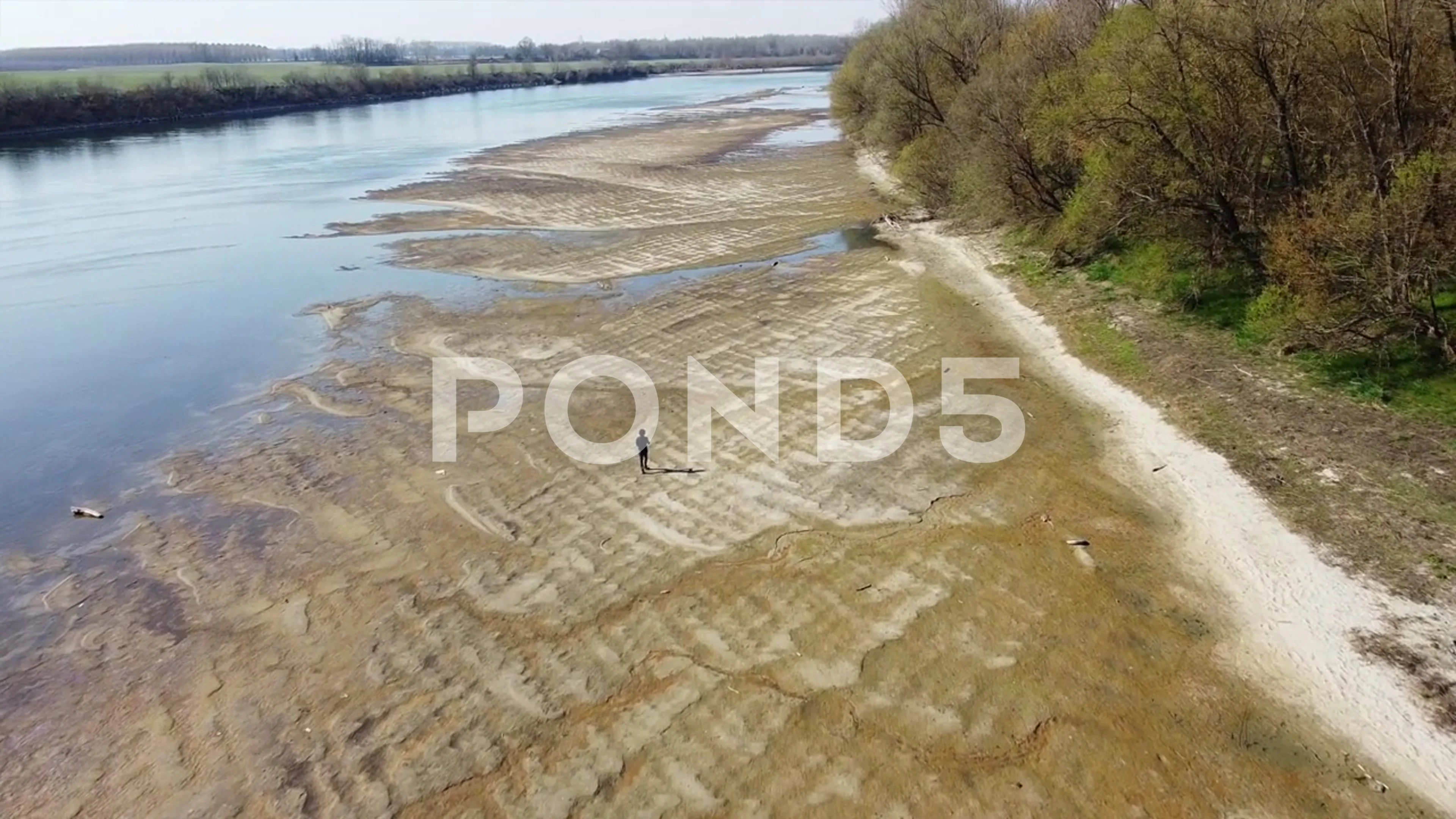 Italy - drought and aridity in the almost waterless Po river with large  expanses of sand and