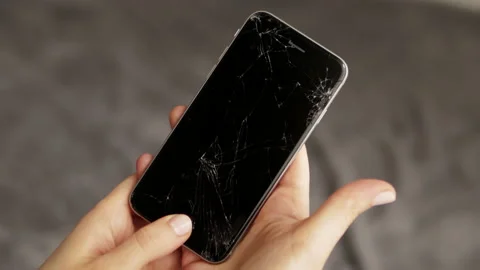 Problems with a faulty mobile phone with a broken screen Stock Footage 195696083