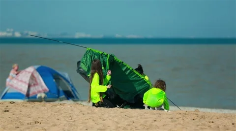 Problems with the installation of tents on the beach Stock Footage 68837633