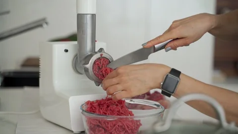 Problems with process lard or meat in minced meat on a huge meat grinder at a Stock Footage 102217981