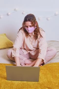 Problems of remote work online during quarantine isolation. A woman in a medi 스톡 사진