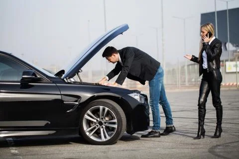 Problems on the road. A broken car on the road Stock Photos