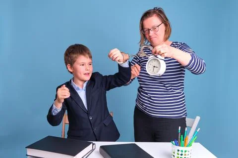 Problems with time in the boy junior schoolboy at school education. 写真素材