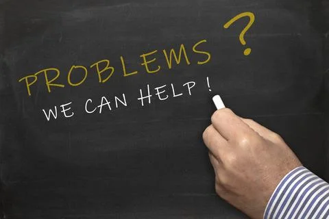 Problems - we can help - female hand with chalk writing text on blackboard Stock Photos