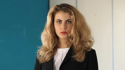 Problems at work-young female manager staring serious at camera Stock-Footage 141681946