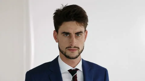 Problems at work - young stressed businessman stares serious at camera Video stock 141737343