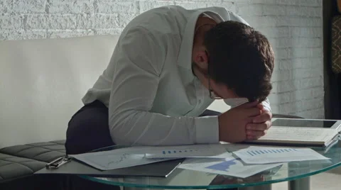 Problems in young businessman in the office with documents. Evening dramatic Stock Footage 51841610