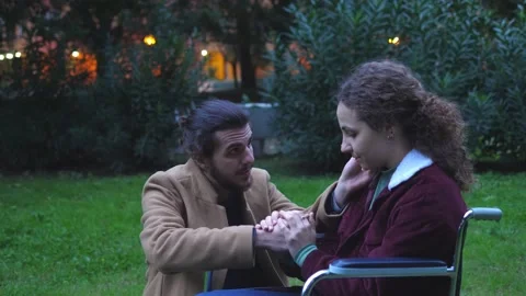 Problems,disability-man says comforting words to disabled girlfriend and leaves  Stockbeeldmateriaal 166229357