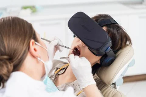 A procedure of drilling a tooth, setting a temporary seal Stock Photos