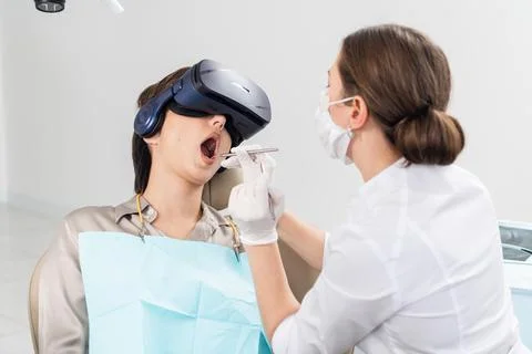 A procedure of drilling a tooth, setting a temporary seal Stock Photos