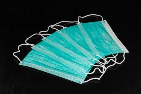 Procedure earloop face mask on dark background Stock Photos