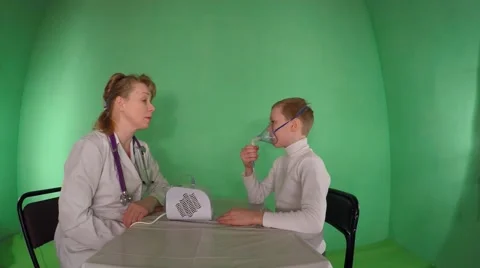 Procedure inhalation of child. Green background 動画素材 60280065