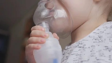 Procedure inhalation of child with a nebulizer Stock Footage 73330818