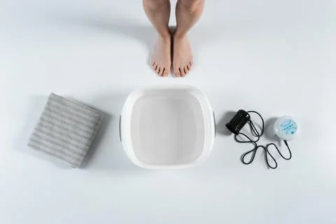 Procedure of ionic detox foot bath machine in spa beauty center isolated Stock Photos