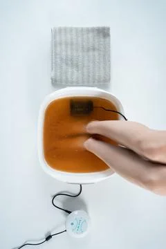 Procedure of ionic detox foot bath machine in spa beauty center isolated Stock Photos