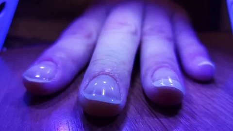 The procedure manicuring nails, polishing, drying. Manicure, nail drying,polish. Stock Footage 318826861