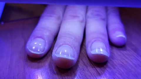 The procedure manicuring nails, polishing, drying. Manicure, nail drying,polish. Stock Footage 318826866