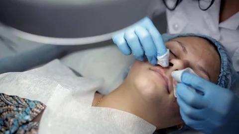 The procedure for mechanical cleansing of the face in the area of the lips Stock Footage 81638282