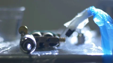 The procedure takes place in the office using a tatoo machine. Stock Footage 70533871