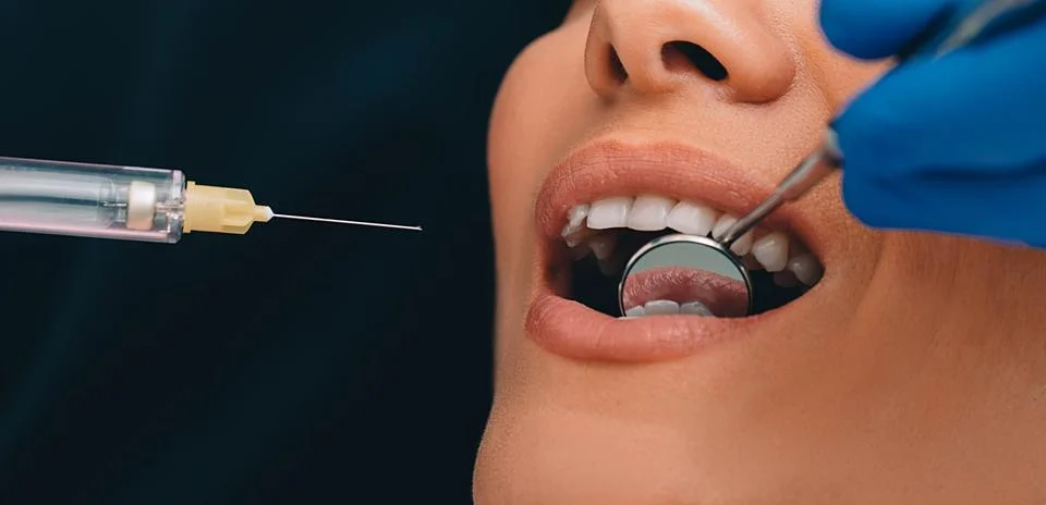 Procedure teeth anesthesia ,macro. Teeth treatment without pain.Syringe with  Fotos Stock