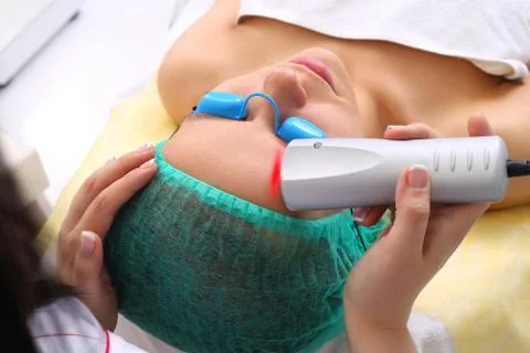 The procedure for treating cold laser. Stock Photos