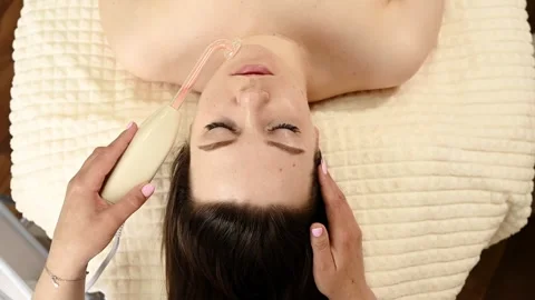 The procedure for wrinkles removal on the face darsonval Overhead view Stock-Footage 246543208