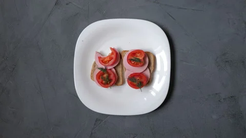 The proces of cooking and eating two delicious sandwiches. Stock Footage 130711073