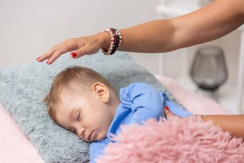Process of access or consciousness bars therapy, woman healing an young boy by 库存照片