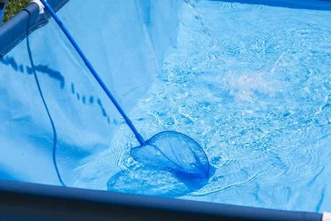 Process of achieving clear, debris-free water in a swimming pool through regular Stock Photos
