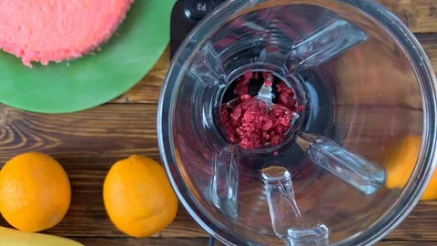Process of adding fresh raspberry in blender, close-up Stock Footage 107809452