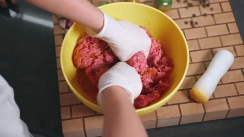 Process of adding spices powder to minced meat in bowl, cookery concept Video stock 219544379