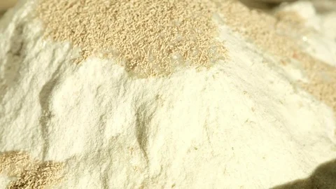 Process of adding sunflower seeds to the dough Stock Footage 80485893