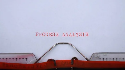 Process analysis - phrase printed on an old typewriter in red letters, close up. Stock Footage 129535827
